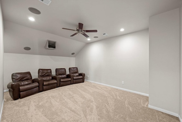 carpeted home theater room featuring visible vents, baseboards, lofted ceiling, ceiling fan, and recessed lighting