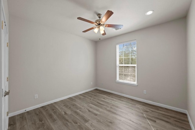 unfurnished room featuring recessed lighting, ceiling fan, baseboards, and wood finished floors