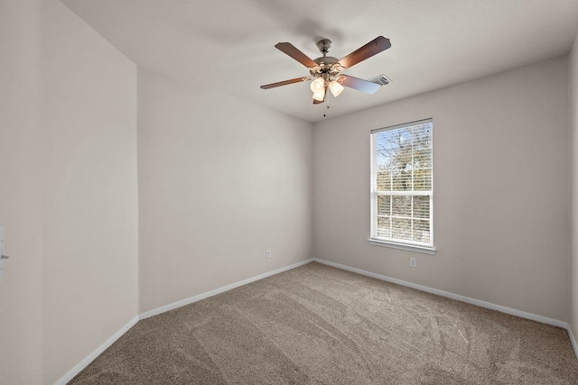 empty room featuring a ceiling fan, baseboards, and carpet flooring