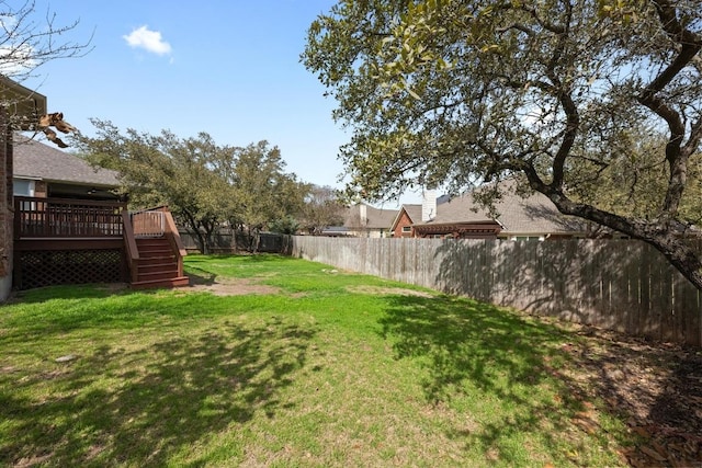 view of yard featuring stairway, a fenced backyard, and a deck