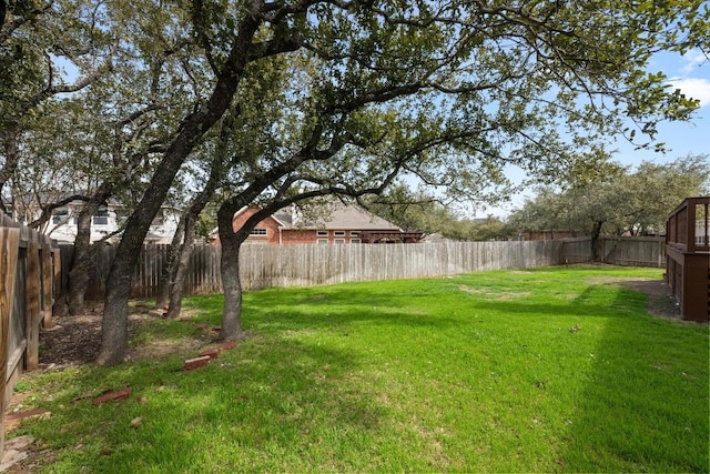 view of yard featuring a fenced backyard