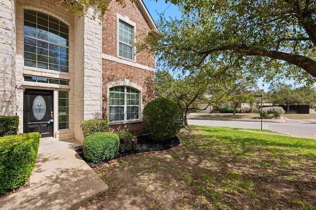 entrance to property with brick siding