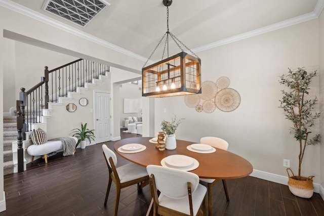 dining space featuring dark wood-style flooring, visible vents, baseboards, stairway, and crown molding