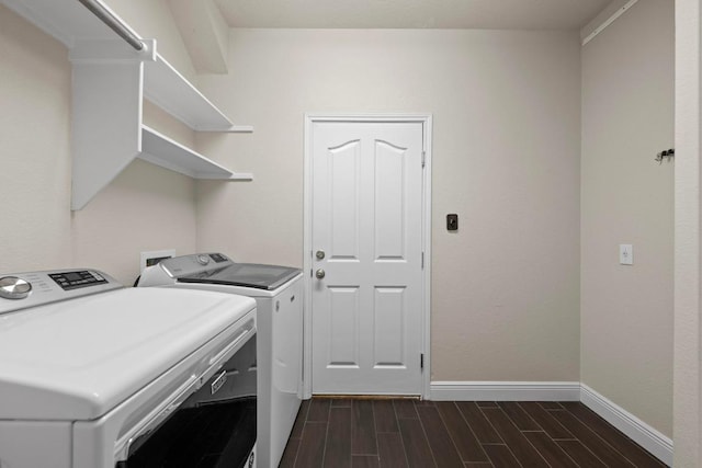 laundry area with laundry area, wood finish floors, independent washer and dryer, and baseboards