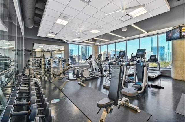 workout area featuring a paneled ceiling