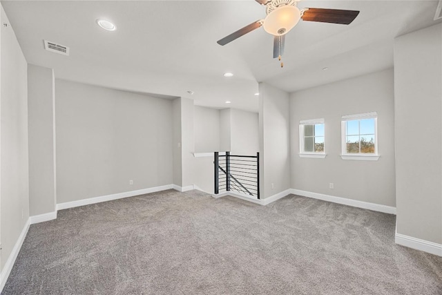 carpeted spare room with baseboards, visible vents, ceiling fan, and recessed lighting