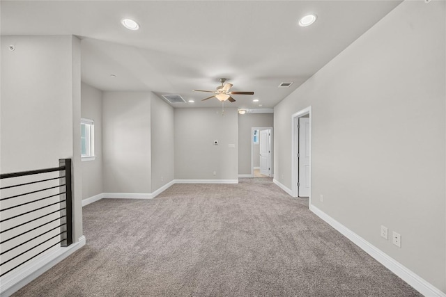 unfurnished room with recessed lighting, visible vents, and baseboards