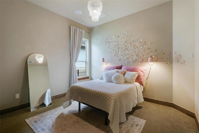 carpeted bedroom featuring a chandelier and baseboards