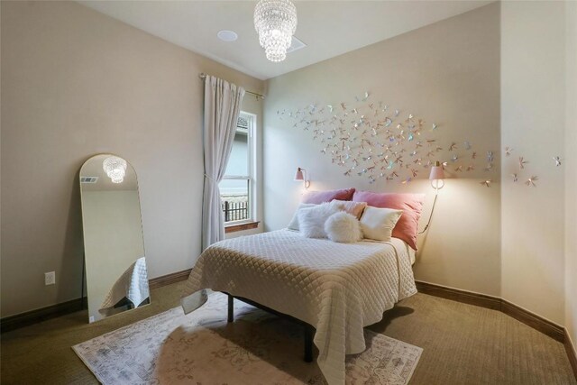 221 Indigo Ln, Georgetown, TX 78628 - carpeted bedroom with baseboards and a chandelier