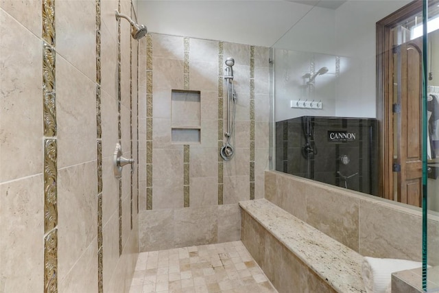 full bathroom with a tile shower