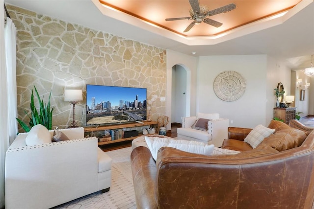 221 Indigo Ln, Georgetown, TX 78628 - living room with a raised ceiling, arched walkways, and a ceiling fan