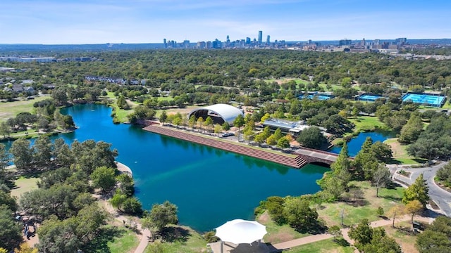 birds eye view of property with a view of city and a water view