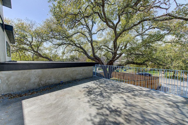 view of patio featuring fence