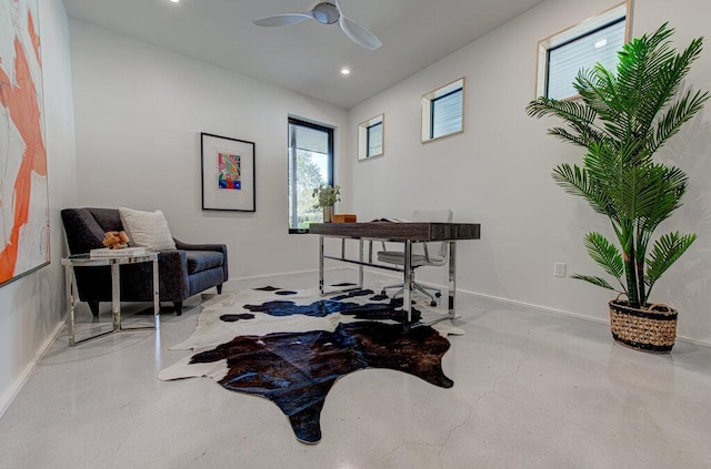 home office featuring ceiling fan, recessed lighting, concrete flooring, and baseboards