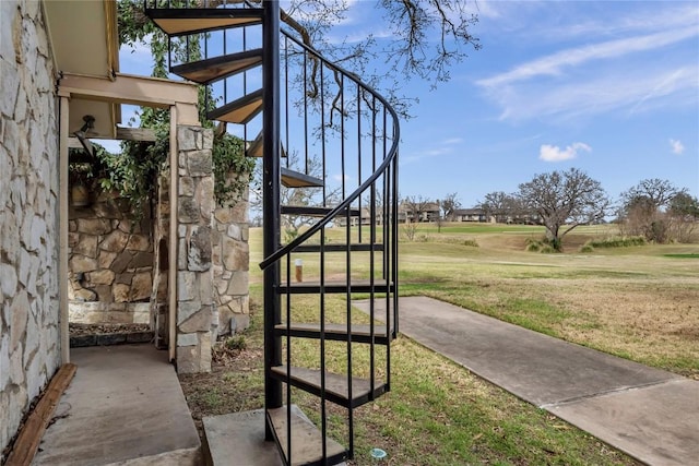 exterior space with a yard and stairway