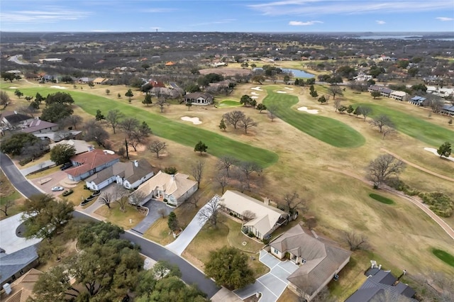 drone / aerial view with a residential view and golf course view