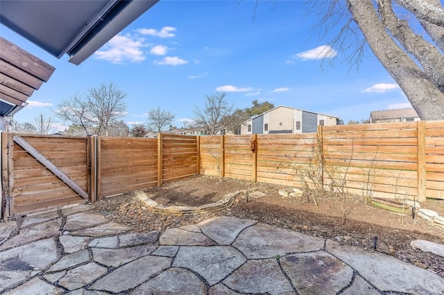 exterior space with a patio and a fenced backyard