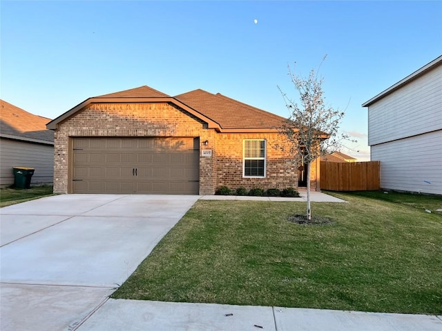 14009 John Aregood Pass, Elgin, TX 78621 - single story home featuring brick siding, a garage, and concrete driveway