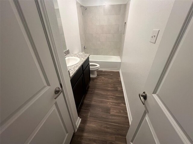 14009 John Aregood Pass, Elgin, TX 78621 - bathroom featuring vanity, wood finished floors, and  shower combination