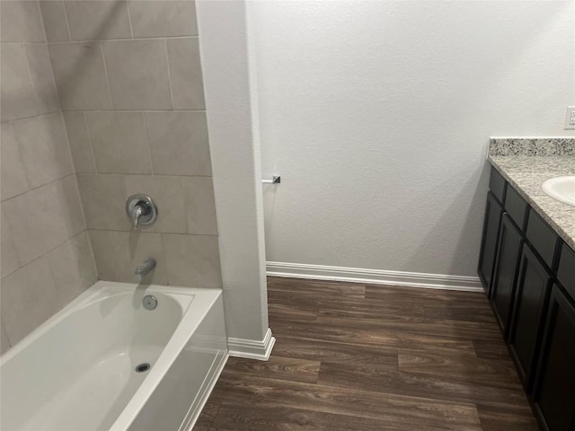 14009 John Aregood Pass, Elgin, TX 78621 - full bath with vanity, wood finished floors, and bathing tub / shower combination