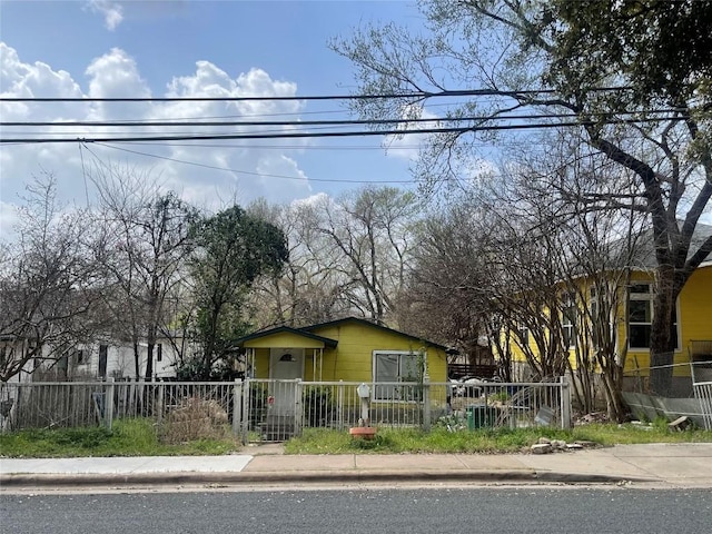 bungalow-style house with a fenced front yard