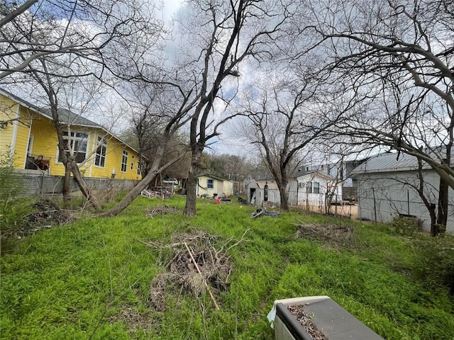 view of yard with fence and a residential view