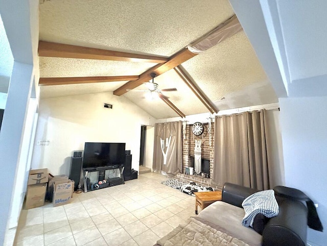 living room featuring light tile patterned floors, lofted ceiling with beams, a brick fireplace, ceiling fan, and a textured ceiling