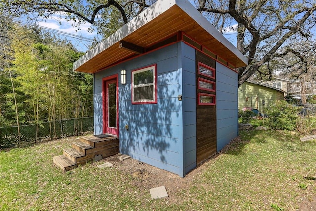 view of outdoor structure with an outdoor structure and fence