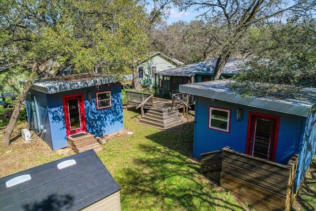 view of yard featuring a wooden deck and an outdoor structure