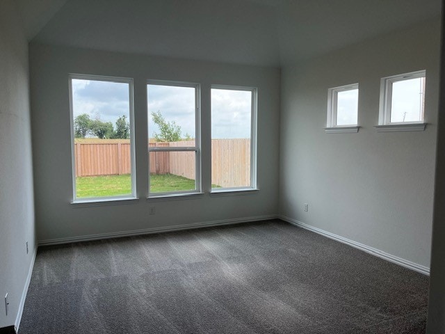 513 Teasley Dr, Taylor, TX 76574 - empty room with dark colored carpet and baseboards