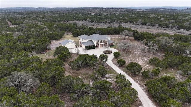 aerial view featuring a view of trees