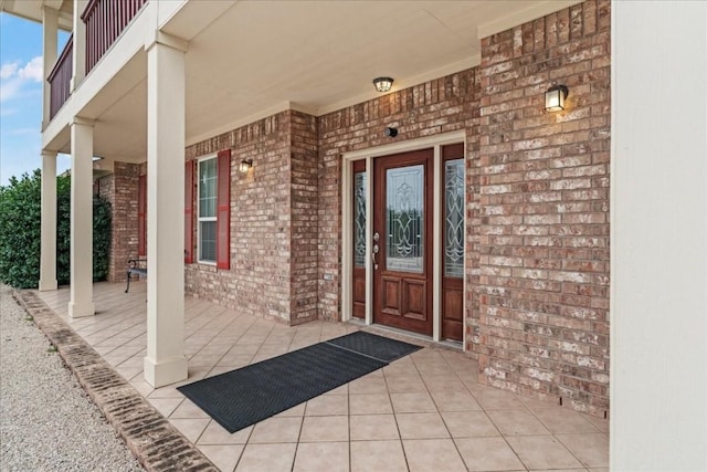 entrance to property with brick siding