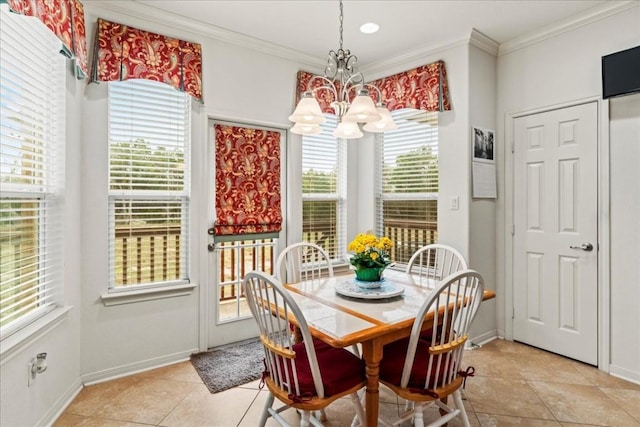 dining room featuring an inviting chandelier, baseboards, light tile patterned floors, and ornamental molding