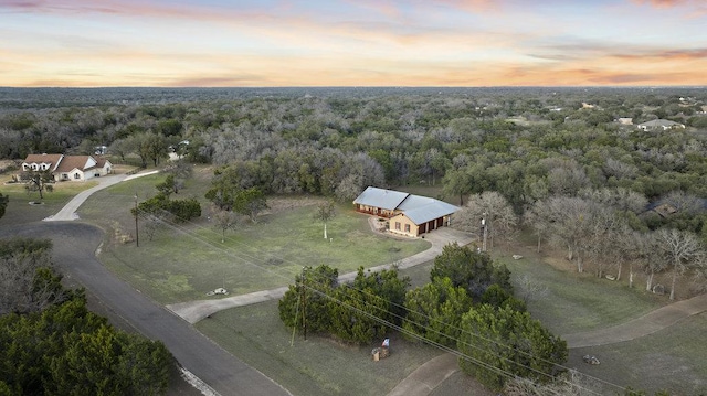 drone / aerial view with a rural view and a wooded view