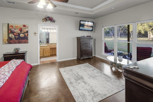 bedroom featuring visible vents, baseboards, crown molding, and a tray ceiling