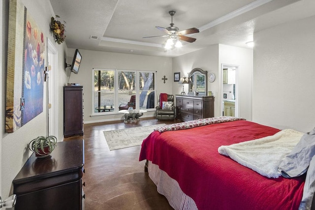 bedroom featuring visible vents, ceiling fan, baseboards, ornamental molding, and a raised ceiling