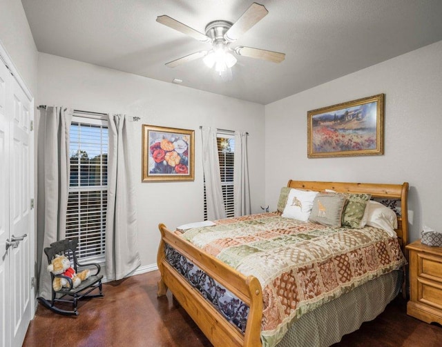 bedroom featuring baseboards and ceiling fan