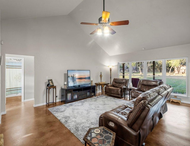 living area with baseboards, high vaulted ceiling, finished concrete flooring, and a ceiling fan