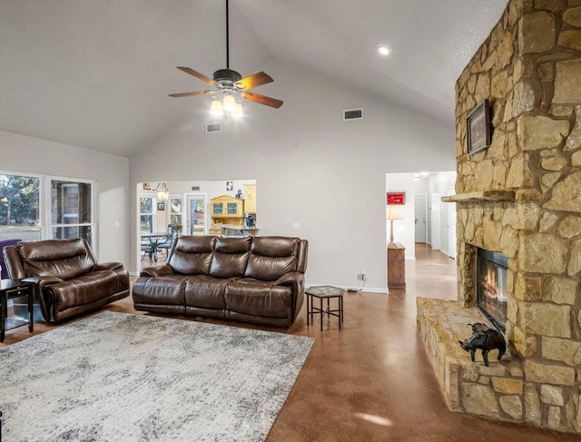 living room featuring visible vents, baseboards, ceiling fan, a fireplace, and high vaulted ceiling