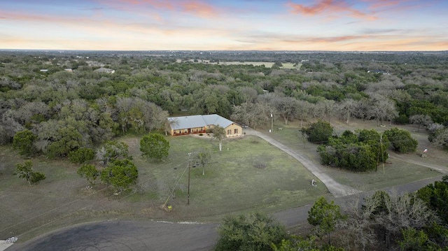 aerial view featuring a wooded view