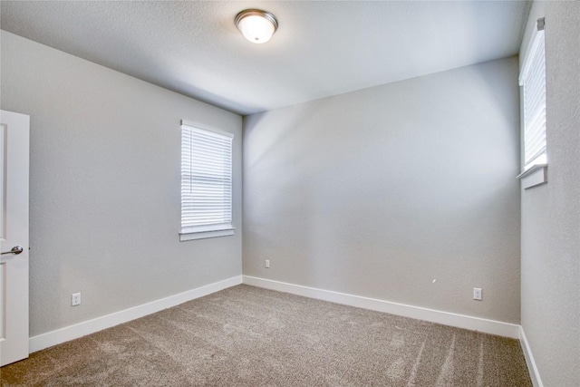 121 Pinnacle Ln, Kyle, TX 78640 - carpeted spare room featuring healthy amount of natural light and baseboards
