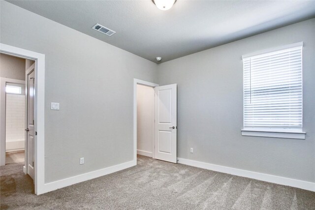 121 Pinnacle Ln, Kyle, TX 78640 - unfurnished bedroom featuring carpet flooring and baseboards