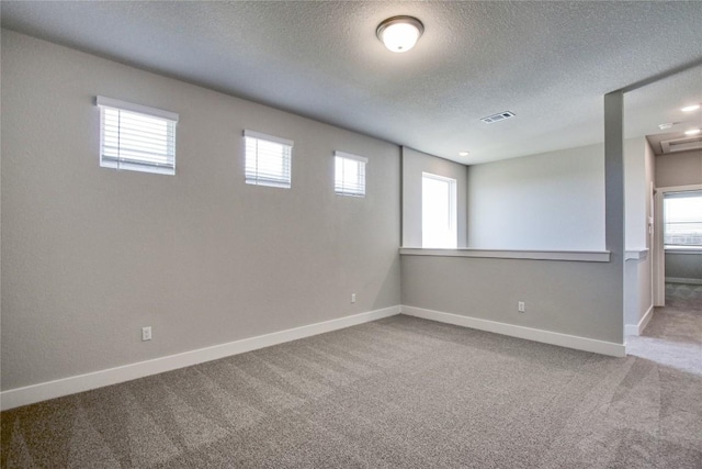 121 Pinnacle Ln, Kyle, TX 78640 - carpeted spare room featuring a textured ceiling and baseboards