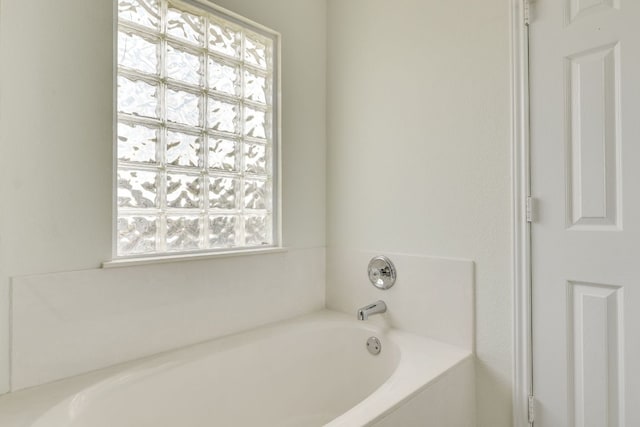 full bath with a garden tub