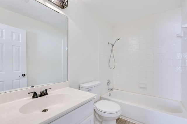 full bath featuring shower / bath combination, vanity, and toilet