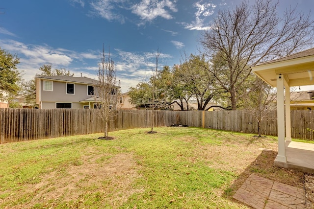 view of yard with a fenced backyard