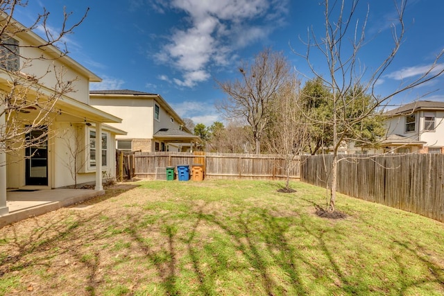 view of yard with a fenced backyard