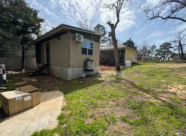 view of side of property with entry steps and fence