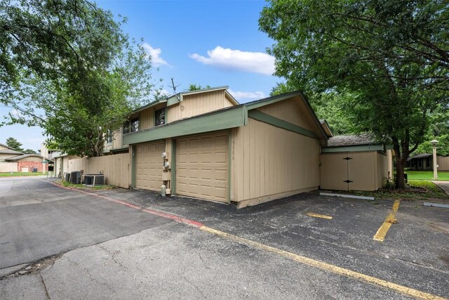 9504 Quail Village Ln, Austin, TX 78758 - view of home's exterior with a central AC unit