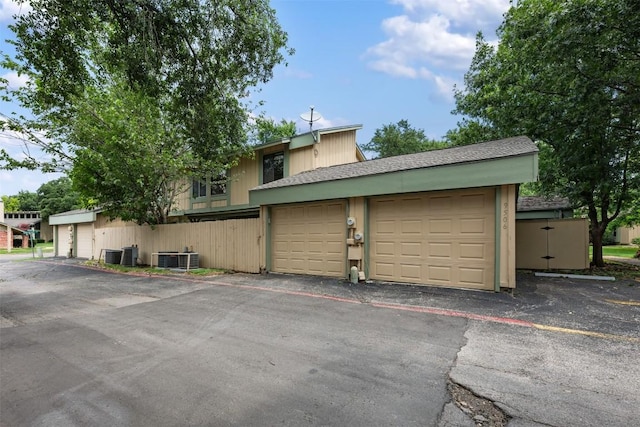 9504 Quail Village Ln, Austin, TX 78758 - townhome / multi-family property with a garage
